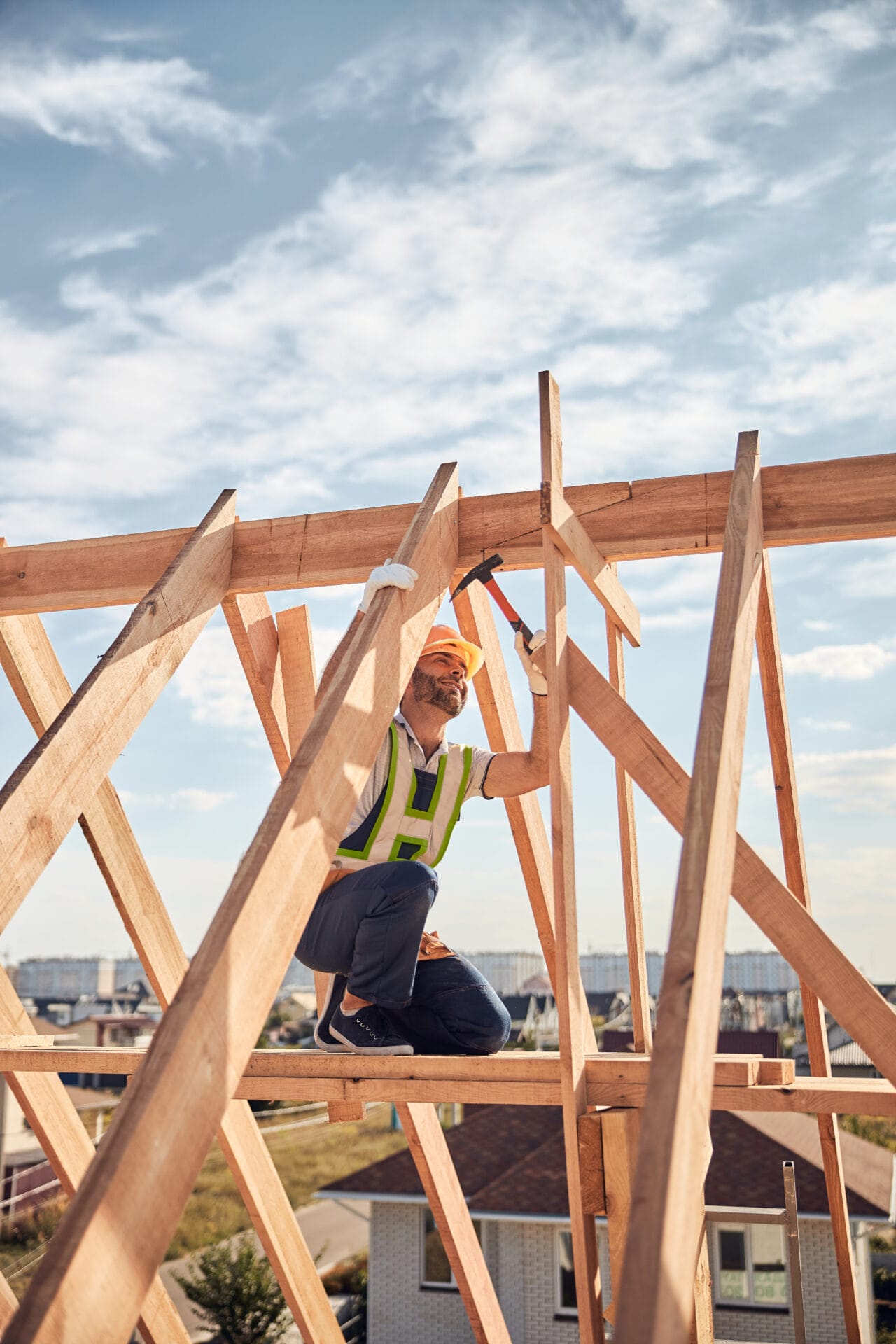 Builder in charge of a hammer-work at a construction site